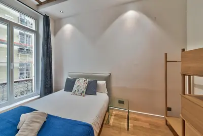 Un ou plusieurs lits dans un hébergement de l'établissement Urban Flat 98 - 4 Bedrooms Apartment center of Paris