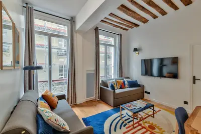 Coin salon dans l'établissement Urban Flat 98 - 4 Bedrooms Apartment center of Paris