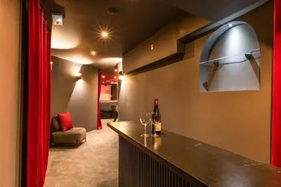 Coin salon dans l'établissement ParisConciergerie - Duplex for 12 with Cinema, 4BR