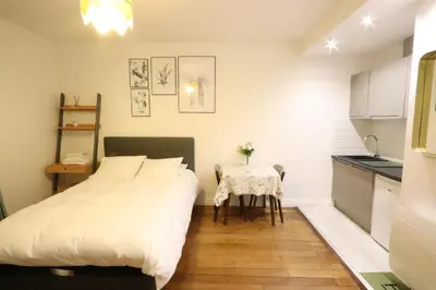 Un ou plusieurs lits dans un hébergement de l'établissement Paris Luxury Studio
