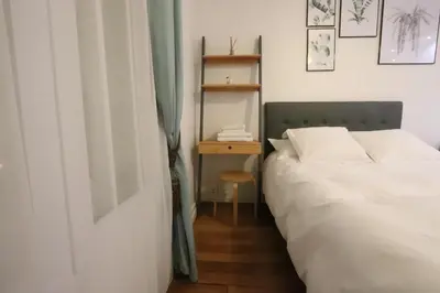 Un ou plusieurs lits dans un hébergement de l'établissement Paris Luxury Studio