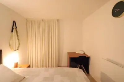 Un ou plusieurs lits dans un hébergement de l'établissement Chambre proche Montmartre
