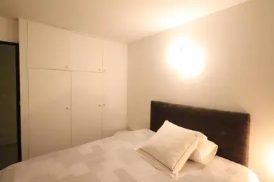 Un ou plusieurs lits dans un hébergement de l'établissement Chambre proche Montmartre