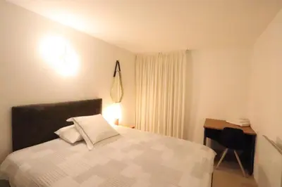 Un ou plusieurs lits dans un hébergement de l'établissement Chambre proche Montmartre
