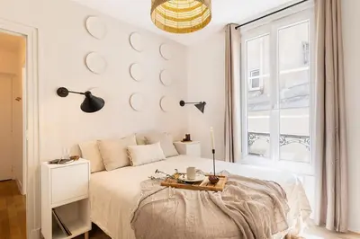 Un ou plusieurs lits dans un hébergement de l'établissement Capri - 2 chambres à Montmartre