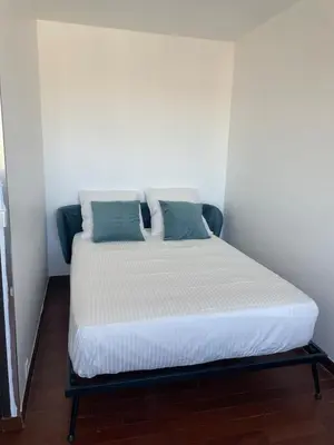 Un ou plusieurs lits dans un hébergement de l'établissement Appartement stunning view Paris