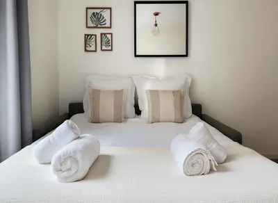 Un ou plusieurs lits dans un hébergement de l'établissement Studio cosy proche des Buttes-Chaumont