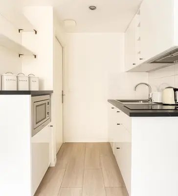 Cuisine ou kitchenette dans l'établissement Studio cosy proche des Buttes-Chaumont