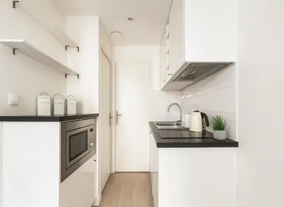 Cuisine ou kitchenette dans l'établissement Studio cosy proche des Buttes-Chaumont
