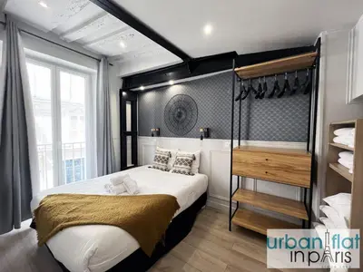 Un ou plusieurs lits dans un hébergement de l'établissement UrbanFlat 44 - Apartment in center of Paris