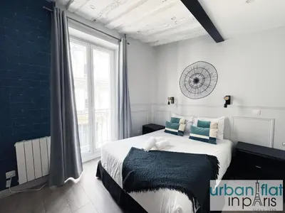 Un ou plusieurs lits dans un hébergement de l'établissement UrbanFlat 44 - Apartment in center of Paris