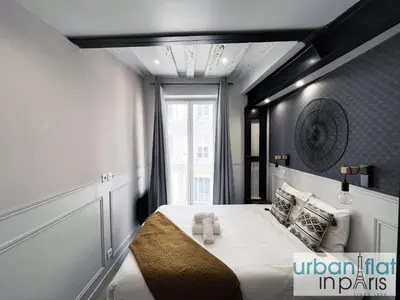 Un ou plusieurs lits dans un hébergement de l'établissement UrbanFlat 44 - Apartment in center of Paris