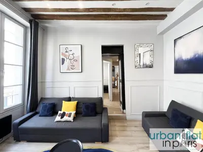 Coin salon dans l'établissement UrbanFlat 44 - Apartment in center of Paris