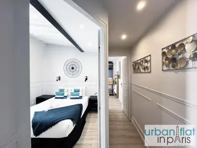 Un ou plusieurs lits dans un hébergement de l'établissement UrbanFlat 44 - Apartment in center of Paris