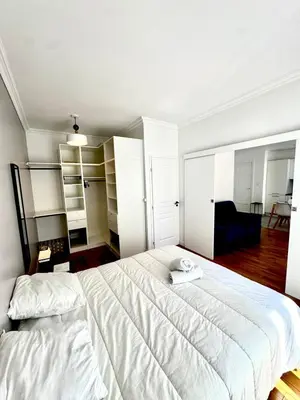 Un ou plusieurs lits dans un hébergement de l'établissement Appartement City Arc de Triomphe
