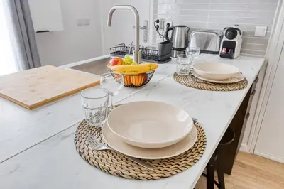 Cuisine ou kitchenette dans l'établissement Suite design Batignolles Lignes 13 & 14