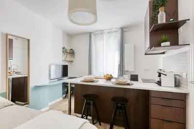 Cuisine ou kitchenette dans l'établissement Suite design Batignolles Lignes 13 & 14