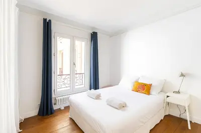 Un ou plusieurs lits dans un hébergement de l'établissement GuestReady - Bright stay in Montmartre