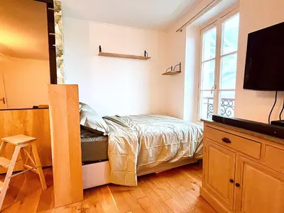 Télévision ou salle de divertissement dans l'établissement Le Penthouse Chevalier - C