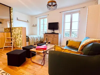 Télévision ou salle de divertissement dans l'établissement Le Penthouse Chevalier - C