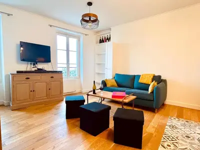 Télévision ou salle de divertissement dans l'établissement Le Penthouse Chevalier - C