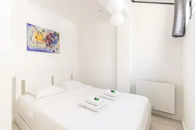 Un ou plusieurs lits dans un hébergement de l'établissement Comfy Flat, Montparnasse