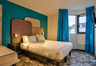 Un ou plusieurs lits dans un hébergement de l'établissement B&B HOTEL Paris Porte de Châtillon