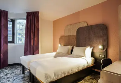 Un ou plusieurs lits dans un hébergement de l'établissement B&B HOTEL Paris Porte de Châtillon