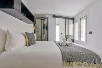 Un ou plusieurs lits dans un hébergement de l'établissement Duplex moderne à 500m des Champs-Elysées