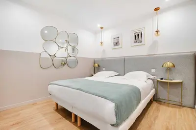 Un ou plusieurs lits dans un hébergement de l'établissement Comfort apartment 1BD-4P with AC - Near Montmartre