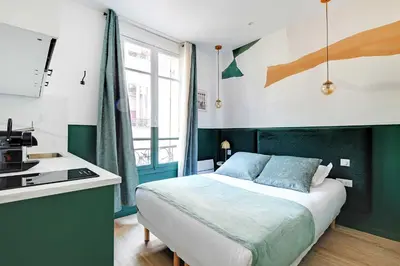 Un ou plusieurs lits dans un hébergement de l'établissement Cozy studio with AC - Near Montmartre