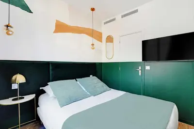 Un ou plusieurs lits dans un hébergement de l'établissement Cozy studio with AC - Near Montmartre