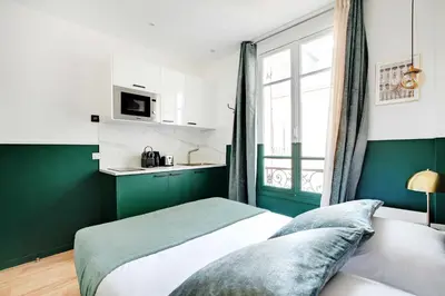 Un ou plusieurs lits dans un hébergement de l'établissement Cozy studio with AC - Near Montmartre