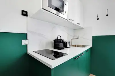 Cuisine ou kitchenette dans l'établissement Cozy studio with AC - Near Montmartre