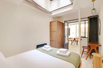 Un ou plusieurs lits dans un hébergement de l'établissement Pick A Flat's Apartments in Montparnasse - Rue La Falguière