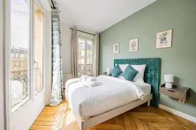 Un ou plusieurs lits dans un hébergement de l'établissement Apartment #2bedrooms #ArtsEtMétiers #République