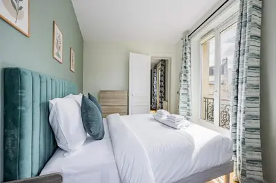 Un ou plusieurs lits dans un hébergement de l'établissement Apartment #2bedrooms #ArtsEtMétiers #République