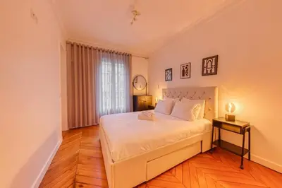 Un ou plusieurs lits dans un hébergement de l'établissement Villiers 2BR 4 pers AC Air-conditioned
