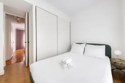 Un ou plusieurs lits dans un hébergement de l'établissement Villiers 2BR 4 pers AC Air-conditioned