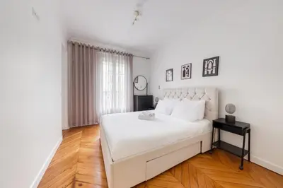 Un ou plusieurs lits dans un hébergement de l'établissement Villiers 2BR 4 pers AC Air-conditioned