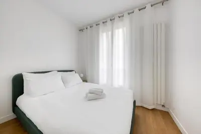 Un ou plusieurs lits dans un hébergement de l'établissement Villiers 2BR 4 pers AC Air-conditioned