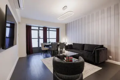 Coin salon dans l'établissement Chic et Comfort in the Heart of the Sentier