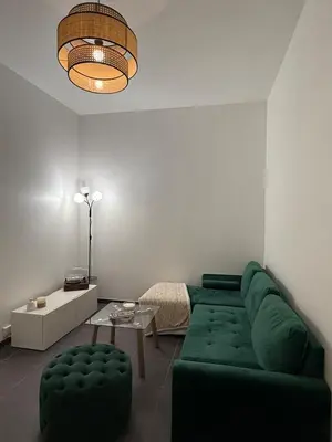 Coin salon dans l'établissement Chez les bibs