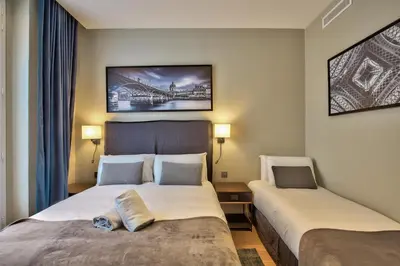 Un ou plusieurs lits dans un hébergement de l'établissement UrbanFlat 75 - Grand Apartment near Jardin du Luxembourg