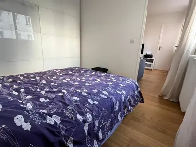 Un ou plusieurs lits dans un hébergement de l'établissement Grand Appartement confort 4 personnes Montmartre