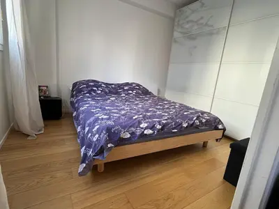 Un ou plusieurs lits dans un hébergement de l'établissement Grand Appartement confort 4 personnes Montmartre