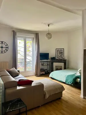 Un ou plusieurs lits dans un hébergement de l'établissement Cozy studio in charming residence