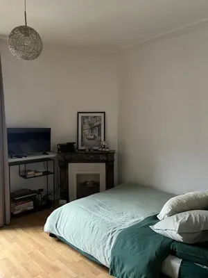 Un ou plusieurs lits dans un hébergement de l'établissement Cozy studio in charming residence