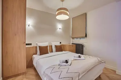 Un ou plusieurs lits dans un hébergement de l'établissement Superb AC apartment Center of Paris Le Marais