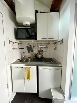 Cuisine ou kitchenette dans l'établissement Le Nid de Timbaud 2P Paris Gestion Immo Daumesnil